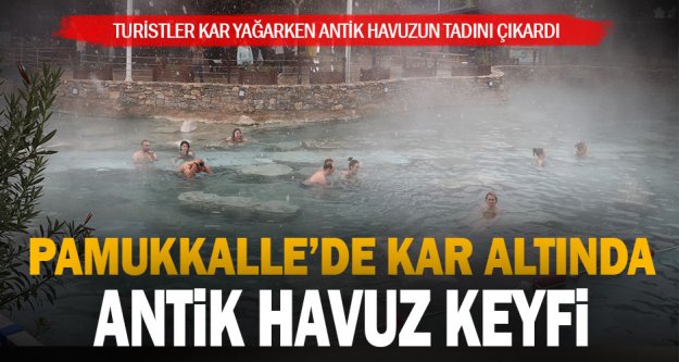Pamukkale'de turistler kar yağarken antik havuzun keyfini çıkardı
